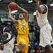 Ypsilanti junior Janeau Joubert shoots around Saginaw High players on Tuesday, March 19. Daniel Brenner I AnnArbor.com
